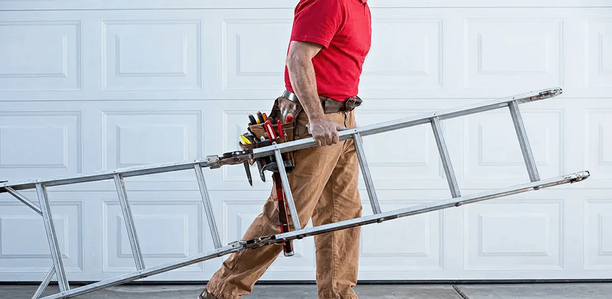Garage door repair technician arriving with tools and ladder in Tucson, AZ